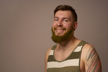 national bearded man in a striped jersey hipster tattoos on his arms