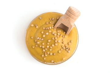 bowl with mustard sauce on a white plate