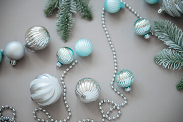New year and Christmas tree decorations on grey background