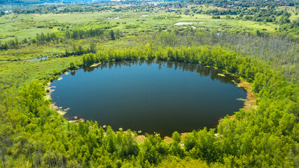 Aerial view of Bottomless  Lake in forest of Solnechnogorsk District, Moscow region. Russia. Aerial view. The lake is perfectly round and its depth is not determined.