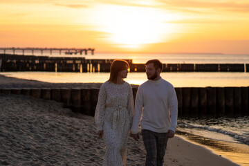 Fototapeta premium Kaliningrad, Russia. Young couple in love on the seaside