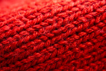 closeup red knitted woolen fabric texture background