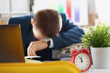 A man sleeps in the workplace, deadline