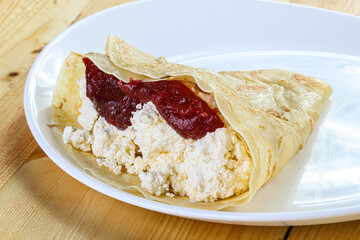 Pancake with cottage cheese and jam