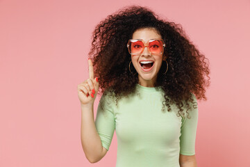 Insighted smart proactive young curly latin woman 20s years old wear mint t-shirt sunglasses...