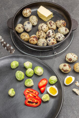 Brussels sprouts, chopped red peppers and half boiled egg on black plate.
