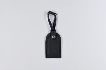 Black bag tag on white paper background