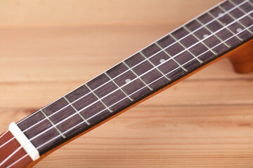 Fototapeta premium Close-up part of small musical instrument Ukulele