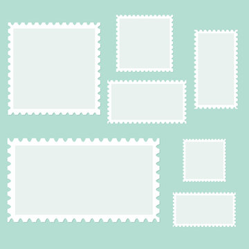 Blank postage stamps isolated on a blue background