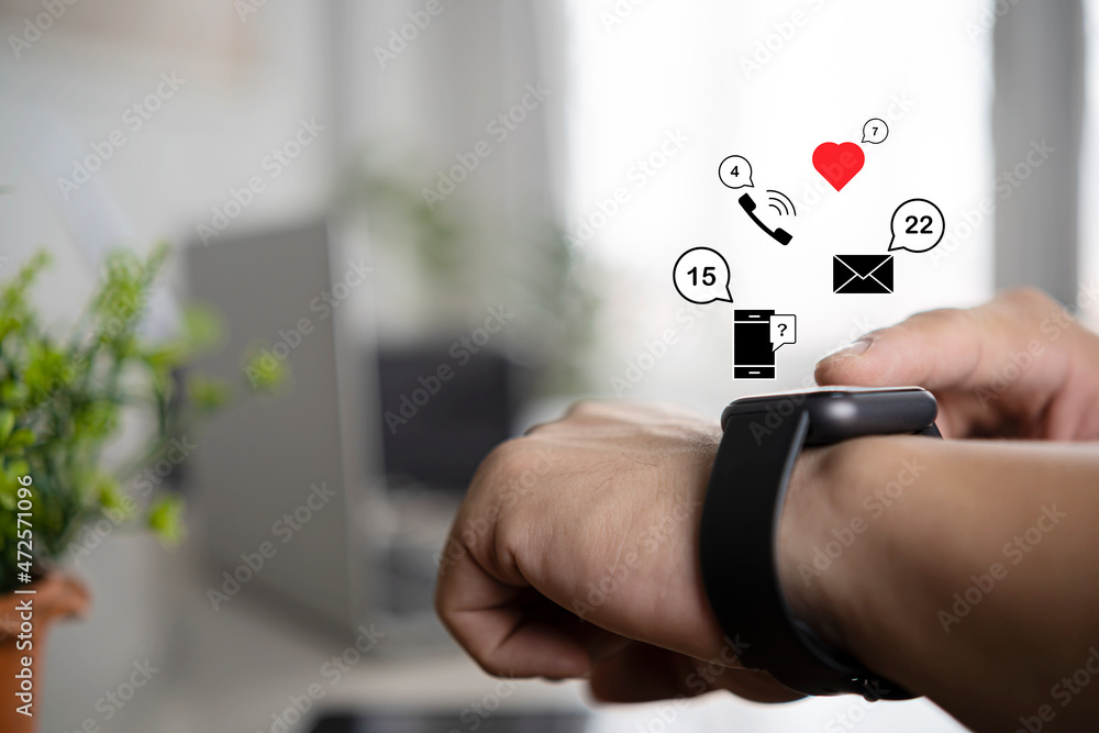 Poster close-up of a young man using a health-tracking smart watch with a virtual screen to measure heart r