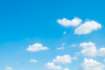 Naklejka na ściany i meble white fluffys clouds sky background with blue sky background for copyspace