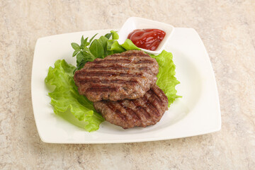 Grilled beef burger cutlet with sauce