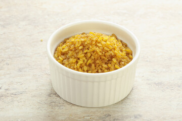 Raw bulgur in the bowl