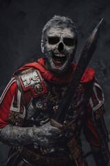 Creepy centurion zombie with gladius against dark background © Fxquadro