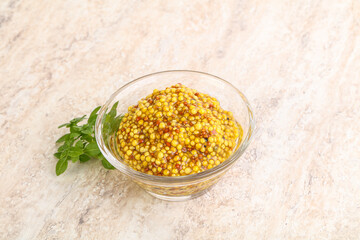 Grain mustard sauce in the bowl