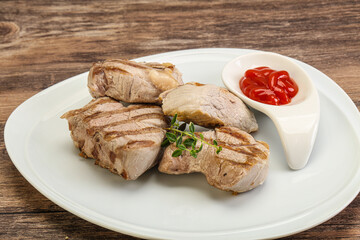 Grilled pork tenderlion with tomato sauce