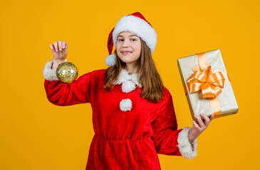 christmas shopping time. teen girl feel happiness. sale for presents and gifts. happy santa claus child. smiling kid in red santa hat and costume. celebrate winter holidays. Shopping Center