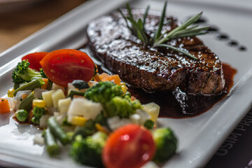 beef steak with vegetables and rosemary