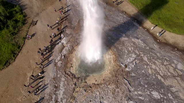 Aerial Cinematic footage of the Impressive Icelands Geysir Geisir in the Golden Circule, the geothermal activity and a attraction for tourists in Iceland	