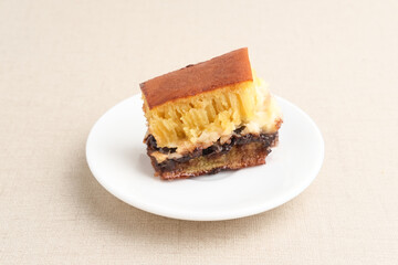 Martabak Manis or Kue Terang Bulan or Hok Lo Pan with various fillings is snack from Indonesia usually consumed at night. Served in white plate, selective focus image.
