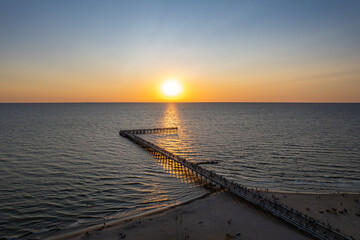 Fototapeta premium Aerial summer sunset view of sunny resort Palanga, Lithuania. Baltic sea, Palanga Bridge - Pier