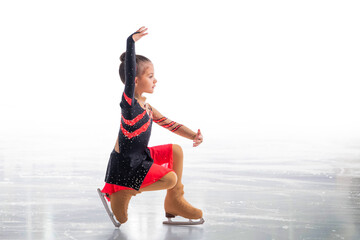 Little skater posing in red and black dress on ice isolat on white background © Maria Moroz