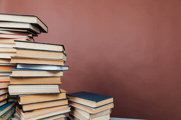 lots of books to study in the university library on a brown background