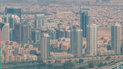 Naklejka na ściany i meble Dubai Aerial view showing al barsha heights and greens district area timelapse