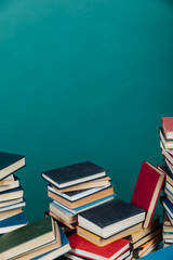 a lot of books to study in the university library on a green background