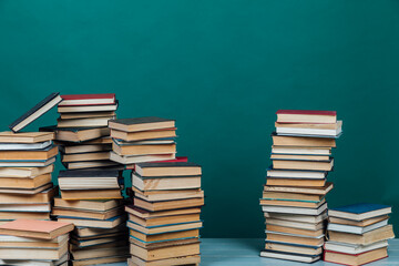 a lot of books to study in the university library on a green background