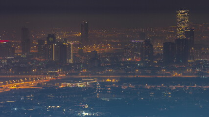 Aerial view of Jumeirah Village Circle district night timelapse