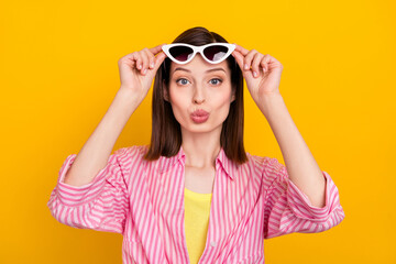 Portrait of adorable gorgeous person arms touch glasses kiss lips look camera isolated on yellow color background