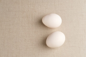 Fresh chicken eggs ( Telur Ayam Kampung ). White eggs with copy space. Selective focus image.
