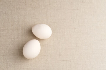 Fresh chicken eggs ( Telur Ayam Kampung ). White eggs with copy space. Selective focus image.
