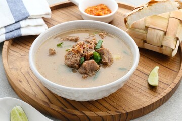 Coto Makassar, traditional food from Makassar, South Sulawesi. made from beef offal mixed with beef, seasoned with specially formulated spices. Usually served with Burasa or Ketupat ( rice cake ).
