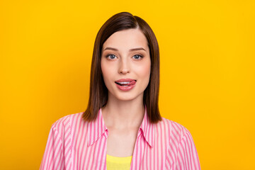 Fototapeta premium Photo of gorgeous tricky young lady tongue licking lips teeth look camera isolated on yellow color background