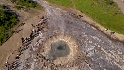 Aerial Cinematic footage of the Impressive Icelands Geysir Geisir in the Golden Circule, the geothermal activity and a attraction for tourists in Iceland	