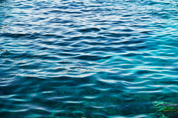 Naklejka premium Surface, texture of sea blue transparent clear water background. Summer holidays border frame concept. Tourist travel, vacation backdrop.