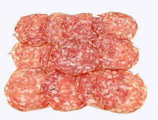 Slices of Finocchiona on white background. It is a traditional salami from Tuscany charaterized by the use of fennel seeds. - obrazy, fototapety, plakaty