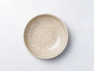 Fototapeta na wymiar Ceramic bowl with cracked pattern