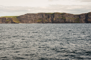 View on Cliff of Moher from a board of a ferry or cruise ship. West coast of Ireland. Popular...