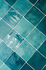 Blue square ceramic tiles. Vertical image. Home design element.