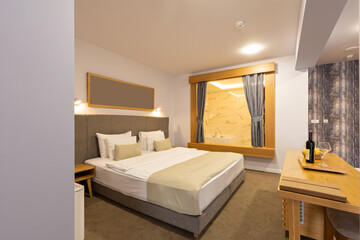 Interior of a luxury hotel double bed bedroom