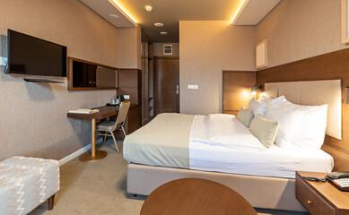 Interior of a luxury hotel double bed bedroom