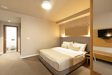 Interior of a luxury hotel double bed bedroom
