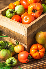 Fresh Ripe Tomatoes in Wooden Box