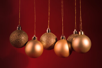 Happy New Year party banner with gold Christmas tree balls against dark red background. Good for traditional Chinese New Year party announcement.