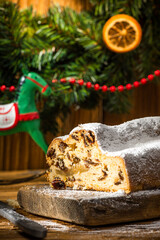 Christmas Stollen on Wooden Background. Festive Homemade Sweet Food