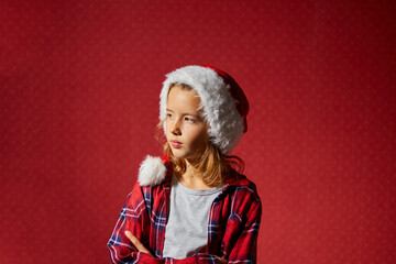 Christmas little Girl in Santa Hat is offended at someone