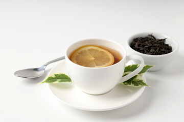 Concept of hot drink with tea on white background